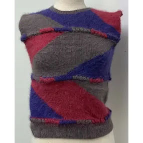 1980 pullover sweater vest designed  by Anny Blatt. Yarns are all 100% long hair French. Hand knit and never worn. SMALL